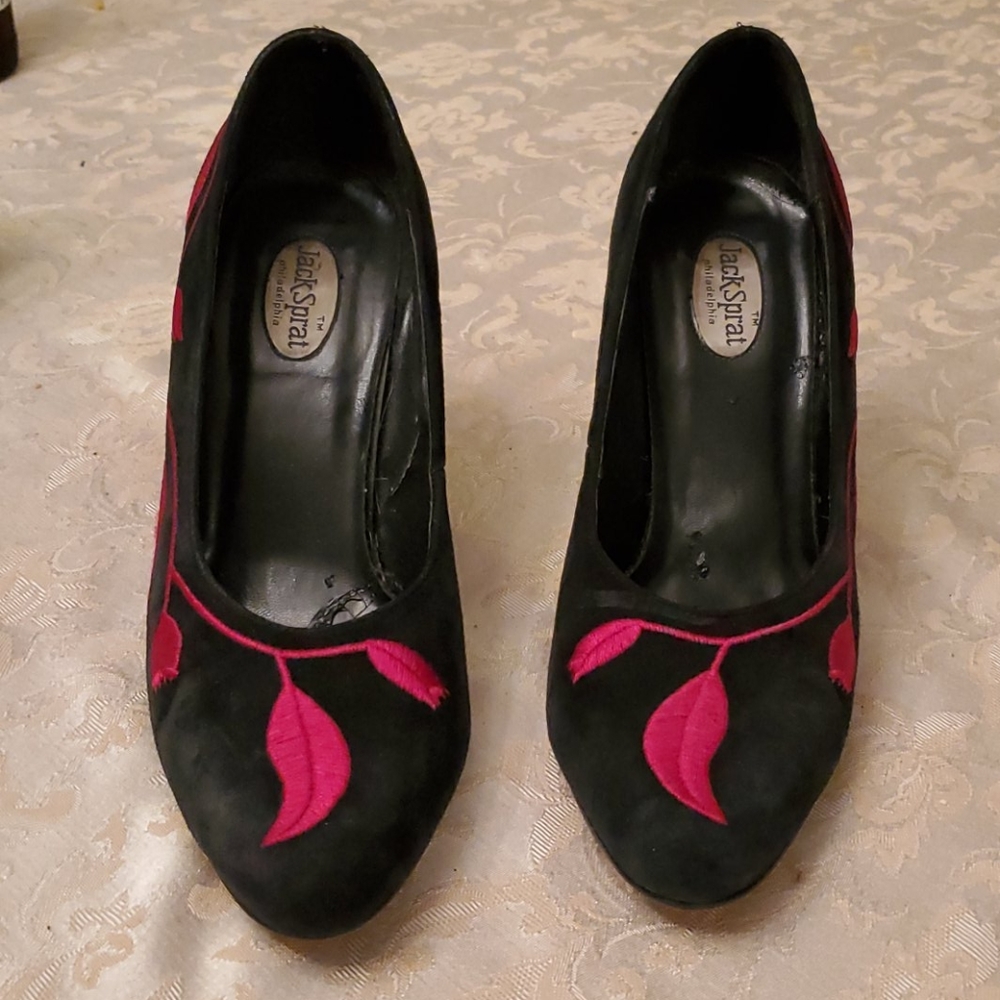 Black suede with red flower detail.